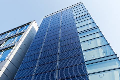 Glass facade with solar panels