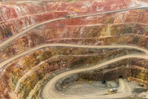 Open-pit mine in red-colored earth