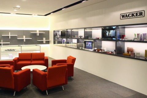 Interior view of the Panyo office with comfortable seating and product display cases