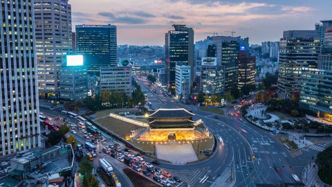 A busy street with many cars in Seoul at night