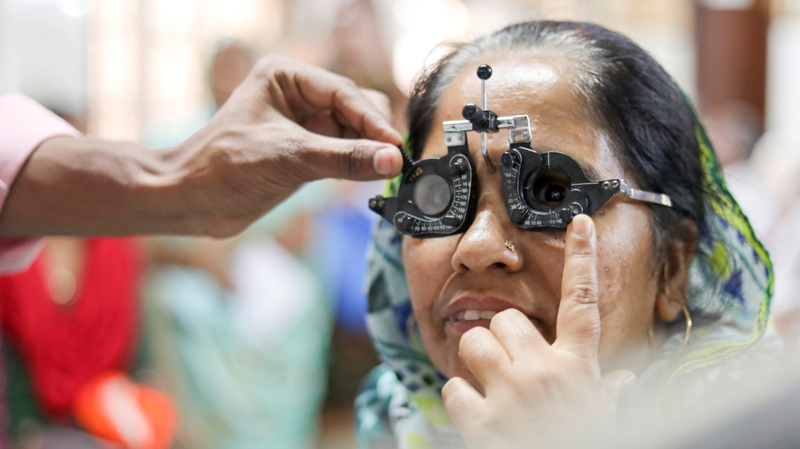 A woman's eyes are examined