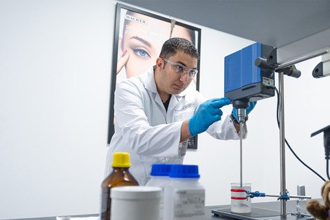 An employee prepares a test in the Consumer Care Lab