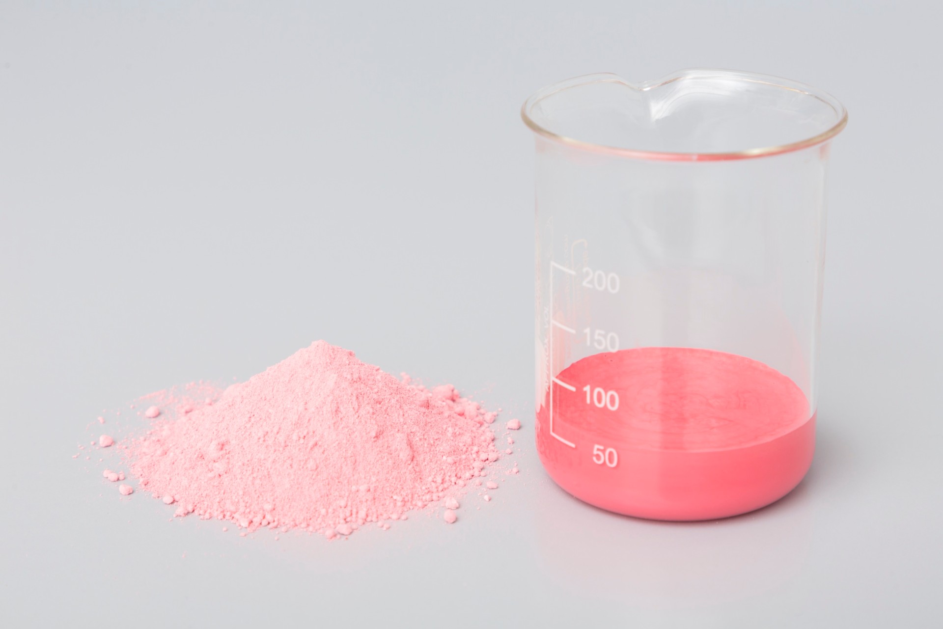 Paint containing NEXIVA&reg; in powder form (left) and redispersed with water (right). 